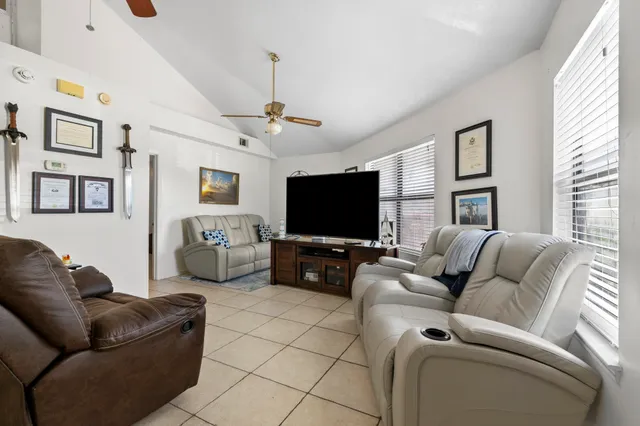 a living room with furniture and a window