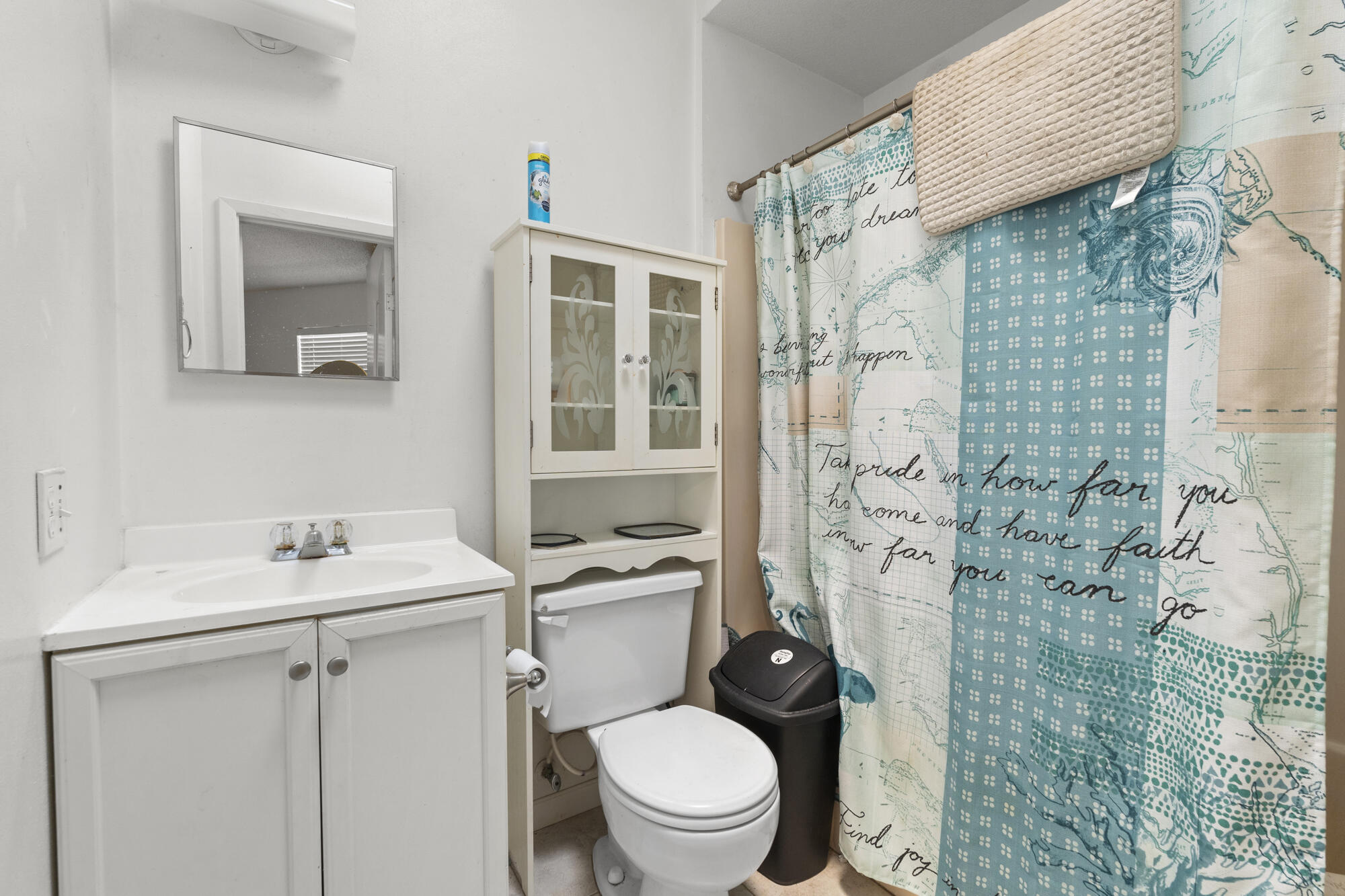 6904 Sea Turtle Circle Navarre, FL 32566 - Photo 30 of 49 a bathroom with a sink toilet vanity and shower