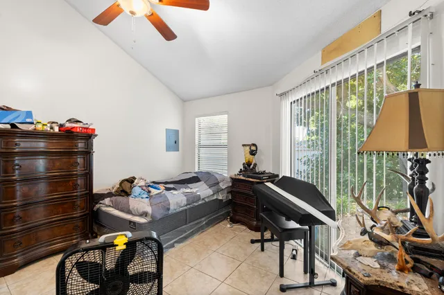 a bathroom with a sink a toilet and a shower curtain
