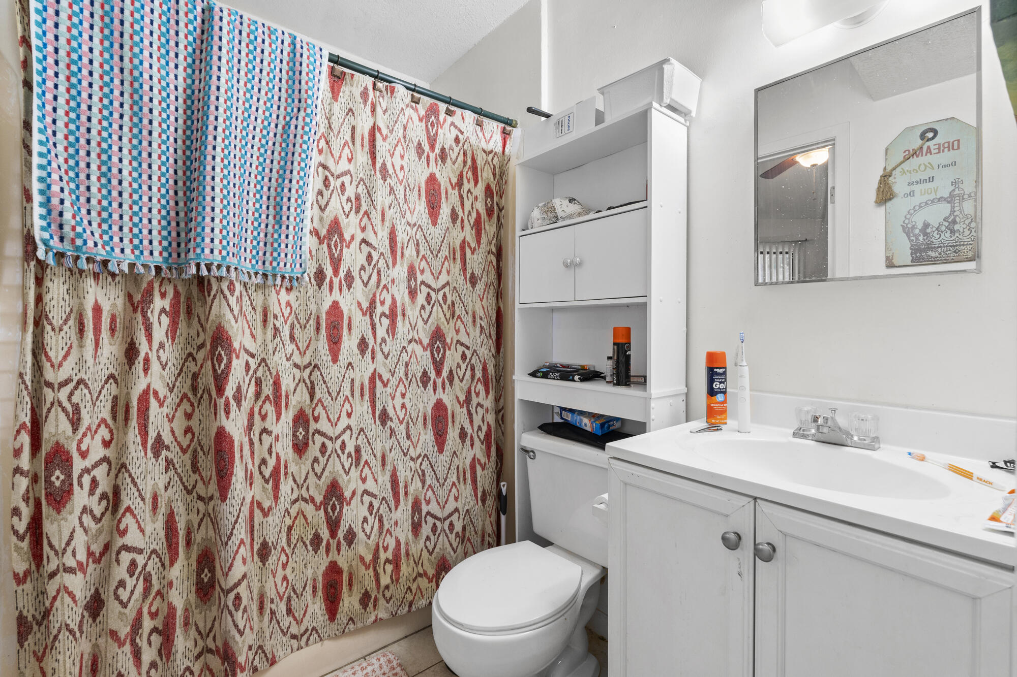 6904 Sea Turtle Circle Navarre, FL 32566 - Photo 33 of 49 a bathroom with a sink toilet and shower