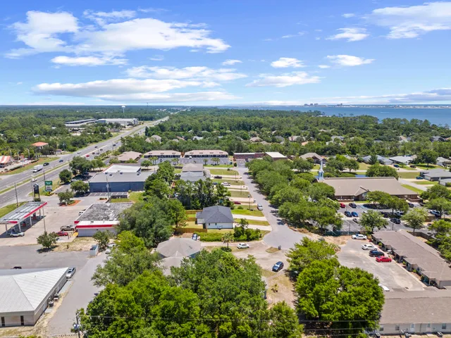 an aerial view of residential houses with outdoor space
