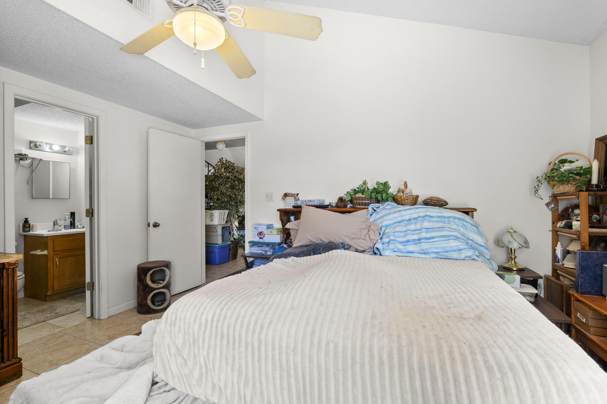 6904 Sea Turtle Circle Navarre, FL 32566 - Photo 42 of 49 a bedroom with a bed and a chandelier