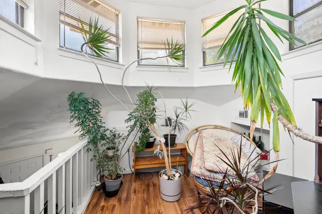 a view of a house with garden and sitting area
