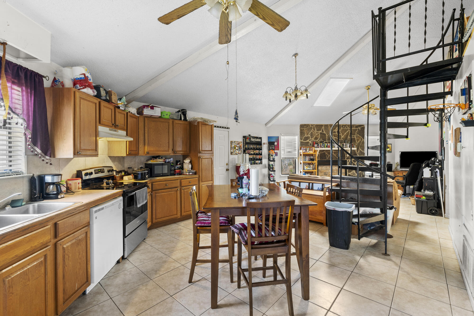 6904 Sea Turtle Circle Navarre, FL 32566 - Photo 9 of 49 a kitchen with lots of wooden furniture appliances and cabinets