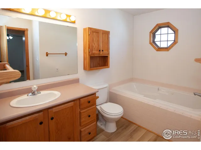 a bathroom with a sink a toilet and a bathtub