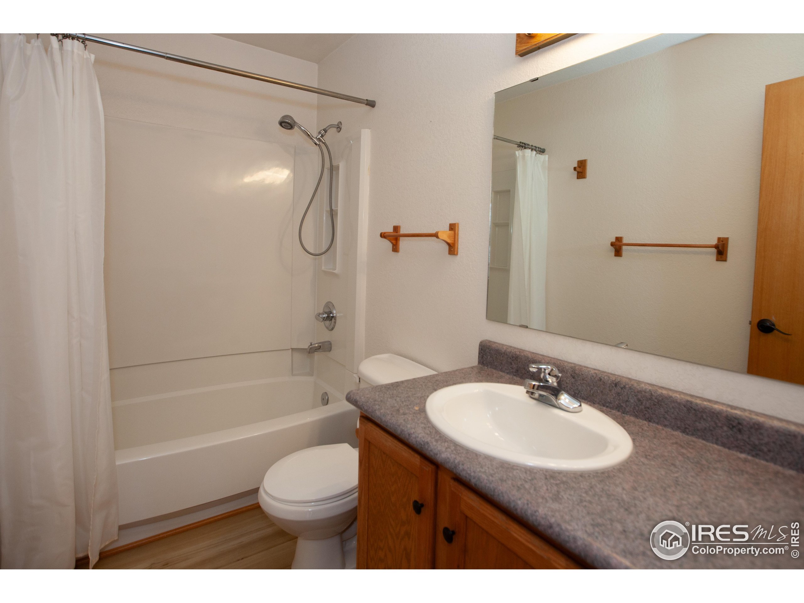 1815 Robin Road Sterling, CO 80751 - Photo 24 of 45 a bathroom with a sink toilet and shower