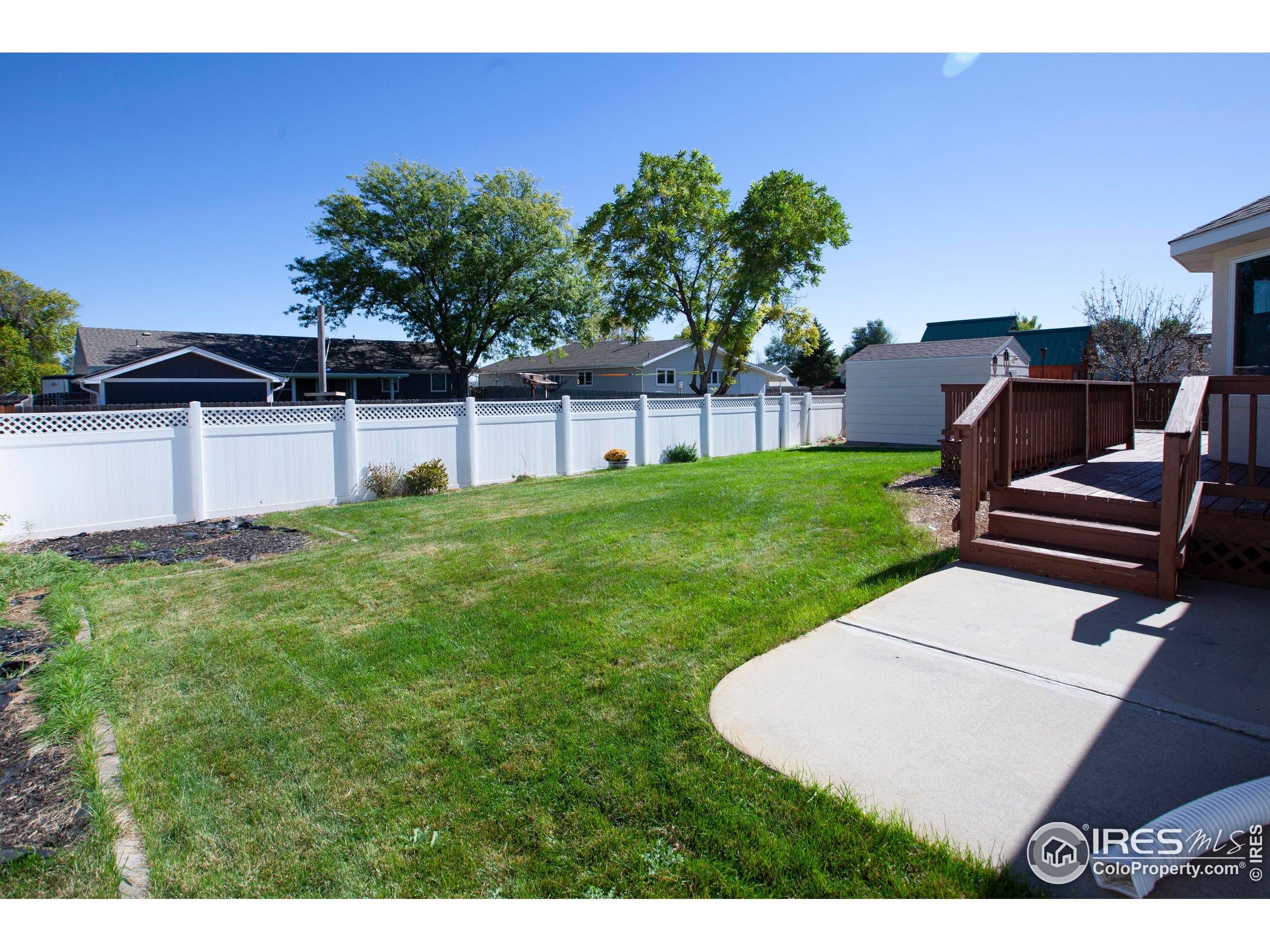 1815 Robin Road Sterling, CO 80751 - Photo 44 of 45 a view of a backyard with sitting area