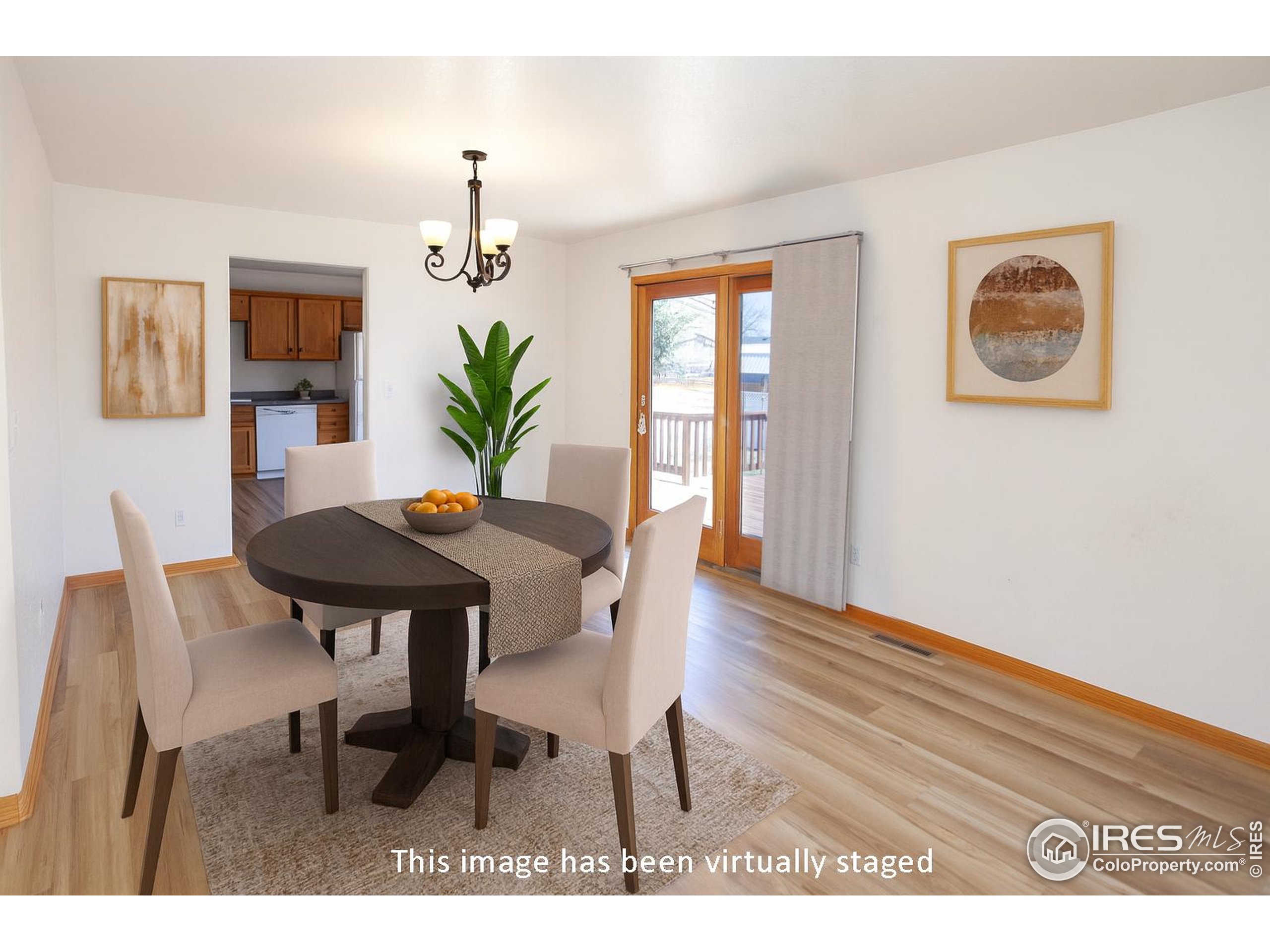 1815 Robin Road Sterling, CO 80751 - Photo 7 of 45 a view of a dining room with furniture and wooden floor