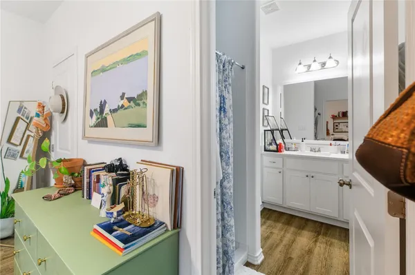 a bathroom with a sink vanity and a mirror