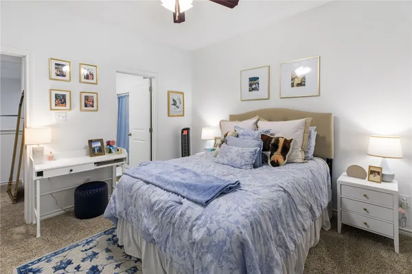 a bedroom with a bed and a desk