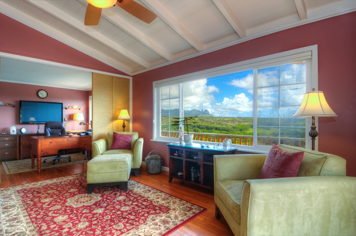 5111 Hassard Road, Unit D Kapaa, HI 96746 - Photo 1 of 1 a living room with furniture and a lamp