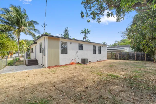 a view of a house with a yard and garage