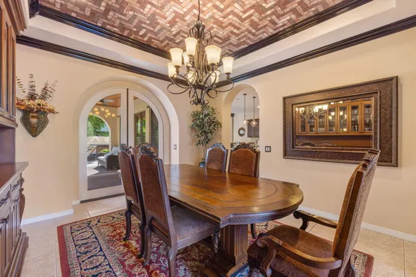 a bedroom with a large bed and a large window