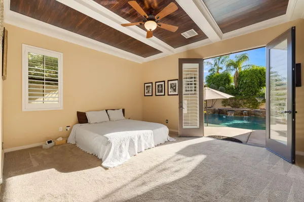 a bathroom with a granite countertop sink a large mirror and a