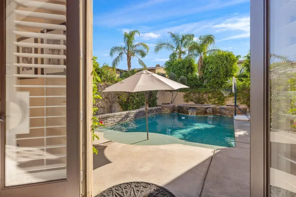 a view of walk in closet with clothes