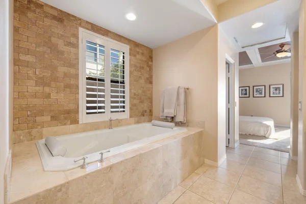 a view of a workspace with furniture and wooden floor
