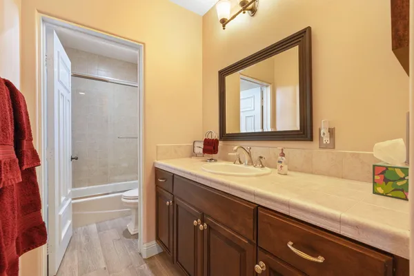 a bedroom with a bed and a book shelf