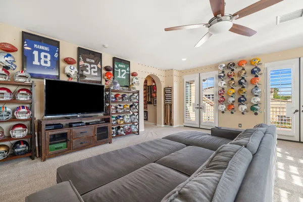 a front view of a house with swimming pool having outdoor seating