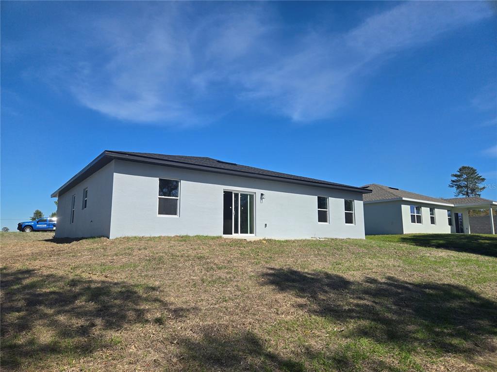 2644 Southwest 162nd Street Road Ocala, FL 34473 - Photo 3 of 47 a view of a house with a yard