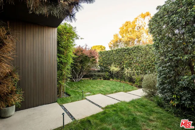 a view of a garden with an outdoor space