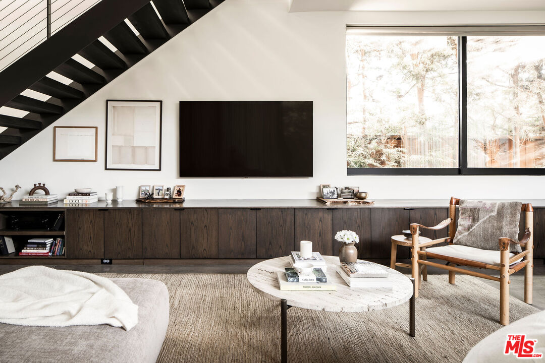 2013 Louella Avenue Venice, CA 90291 - Photo 3 of 26 a living room with furniture a flat screen tv and a large window