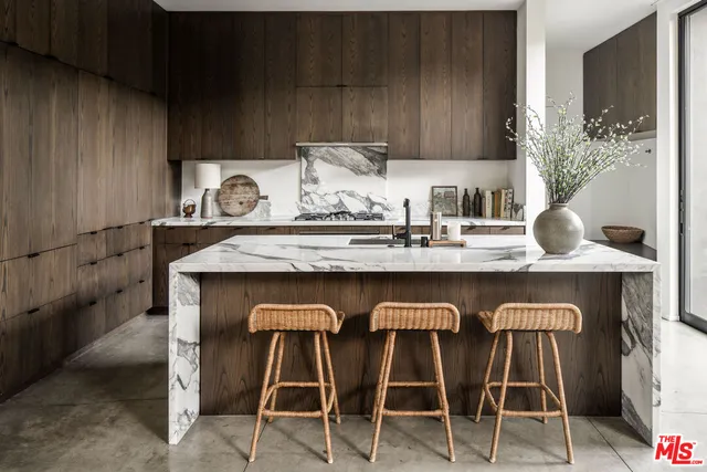 a table with chairs and cabinets