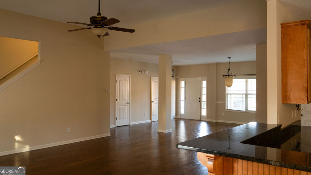170 Fire Crk Trail Senoia, GA 30276 - Photo 11 of 62 a view of empty room with wooden floor and windows