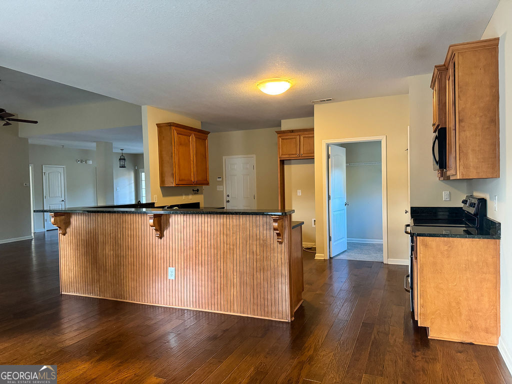 170 Fire Crk Trail Senoia, GA 30276 - Photo 22 of 62 a view of a kitchen with wooden floor