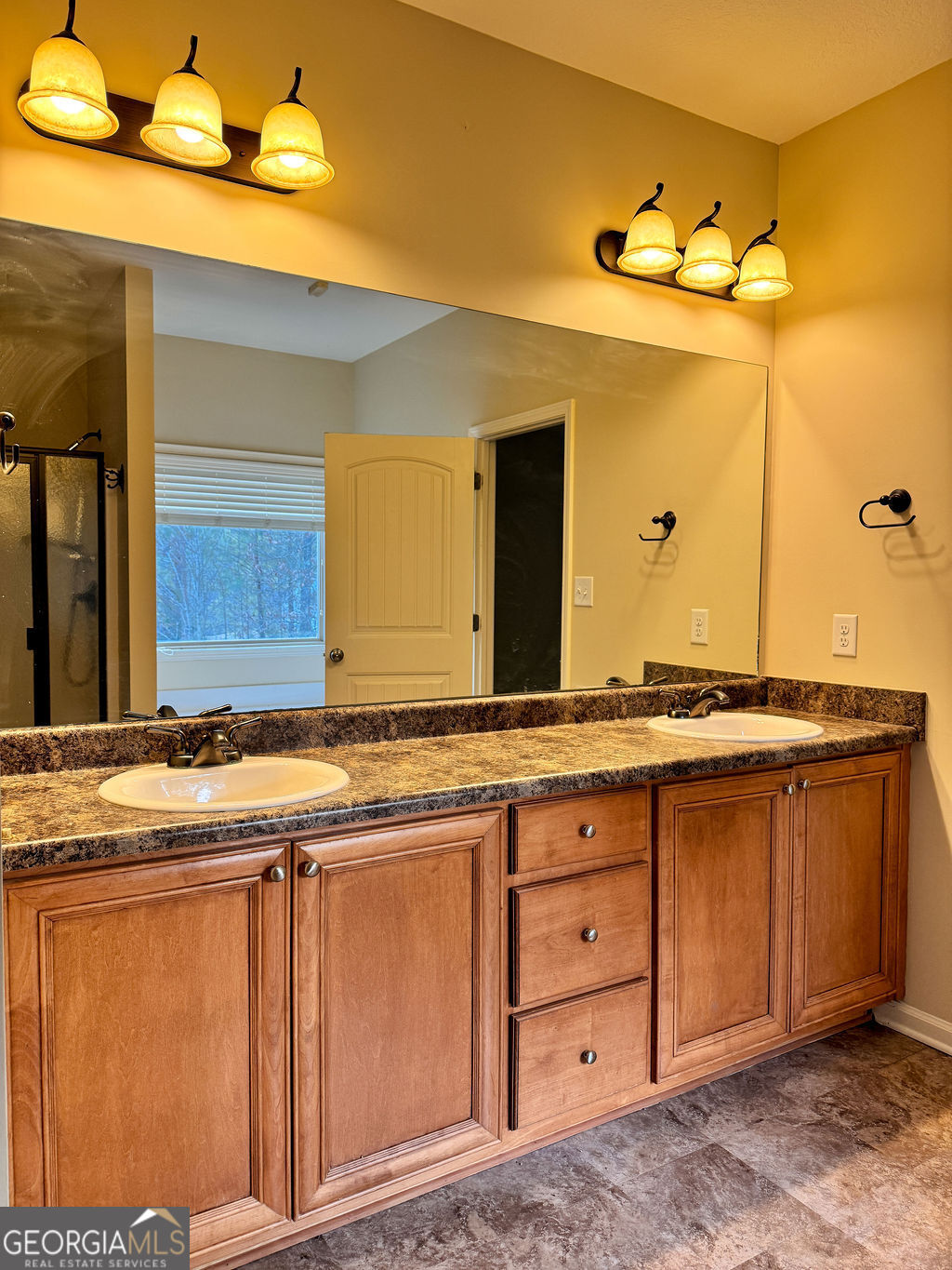 170 Fire Crk Trail Senoia, GA 30276 - Photo 28 of 62 a bathroom with a granite countertop sink and a mirror