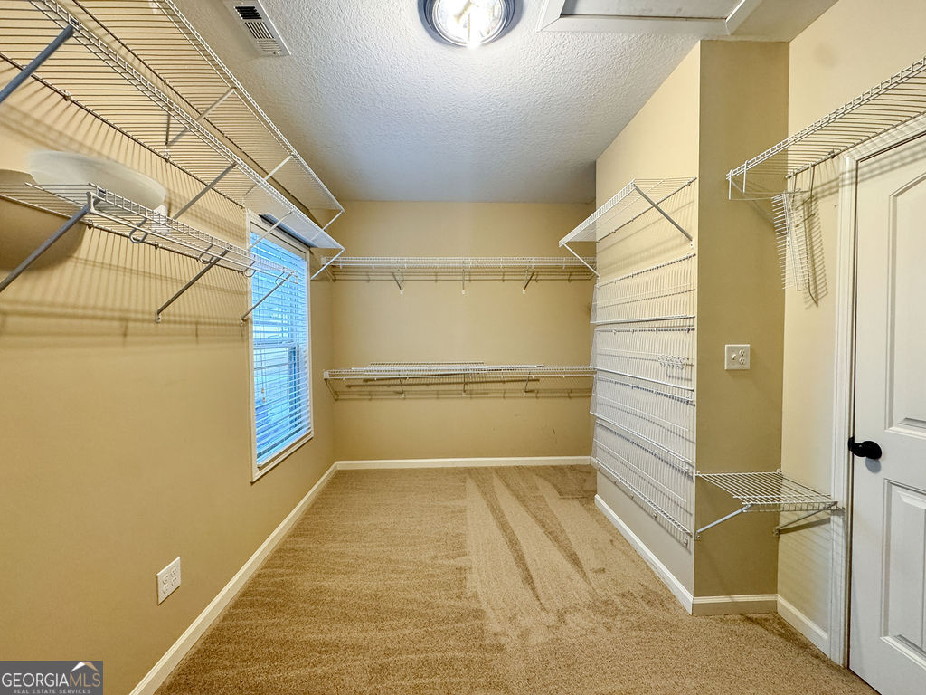170 Fire Crk Trail Senoia, GA 30276 - Photo 30 of 62 a view of a balcony with wooden floor and door