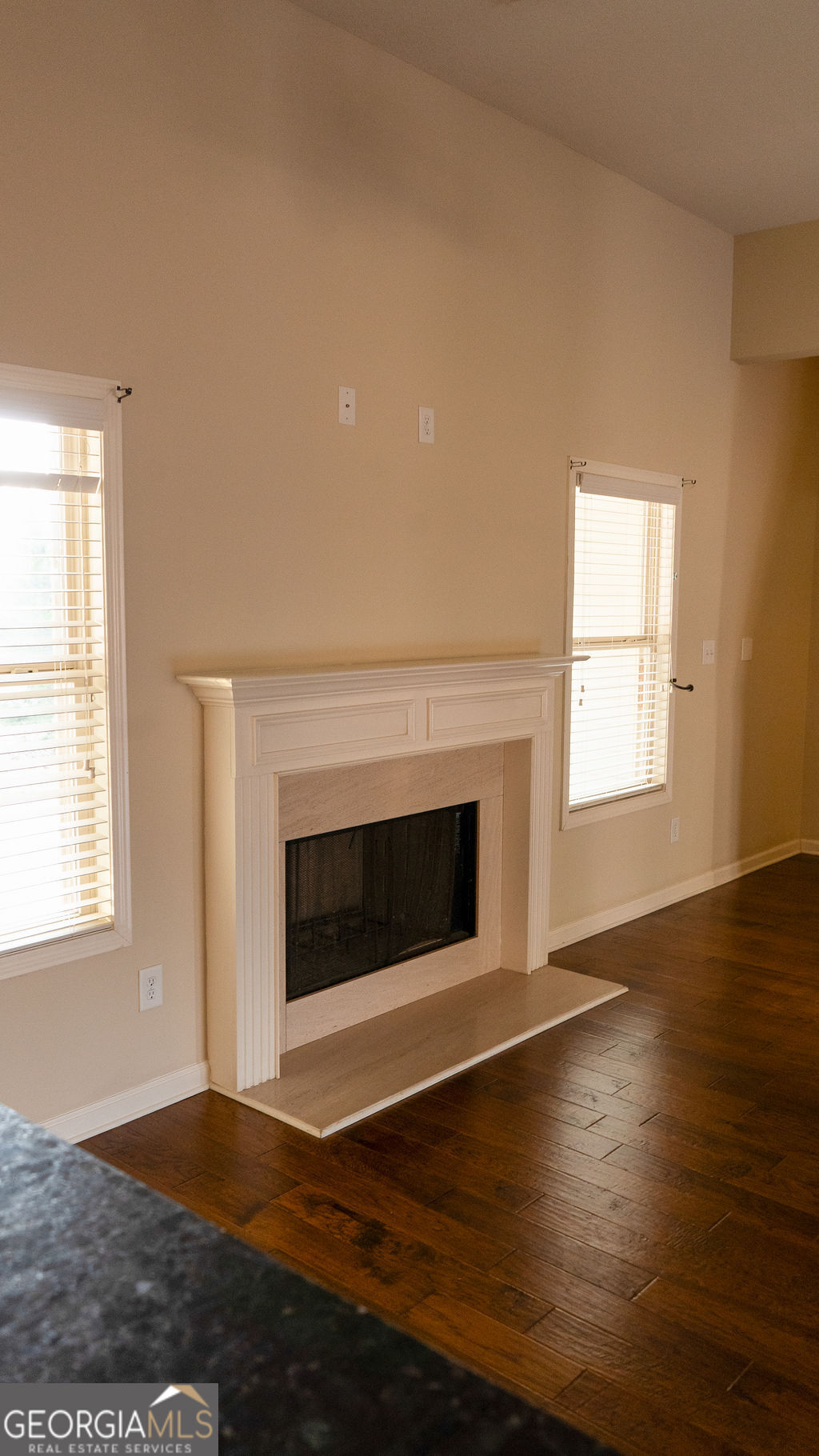 170 Fire Crk Trail Senoia, GA 30276 - Photo 32 of 62 a view of an empty room with wooden floor and a window