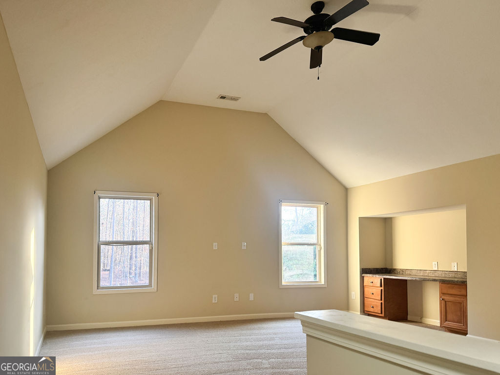 170 Fire Crk Trail Senoia, GA 30276 - Photo 44 of 62 a view of an empty room with a window and wooden floor
