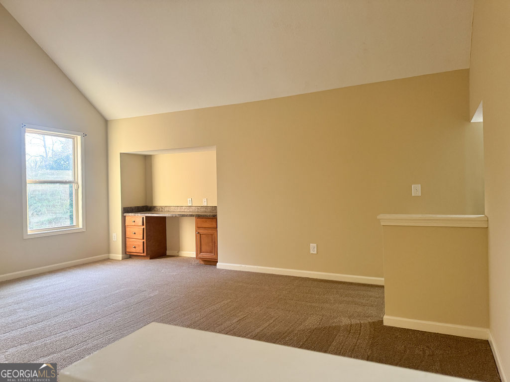 170 Fire Crk Trail Senoia, GA 30276 - Photo 45 of 62 a view of empty room with wooden floor and fan