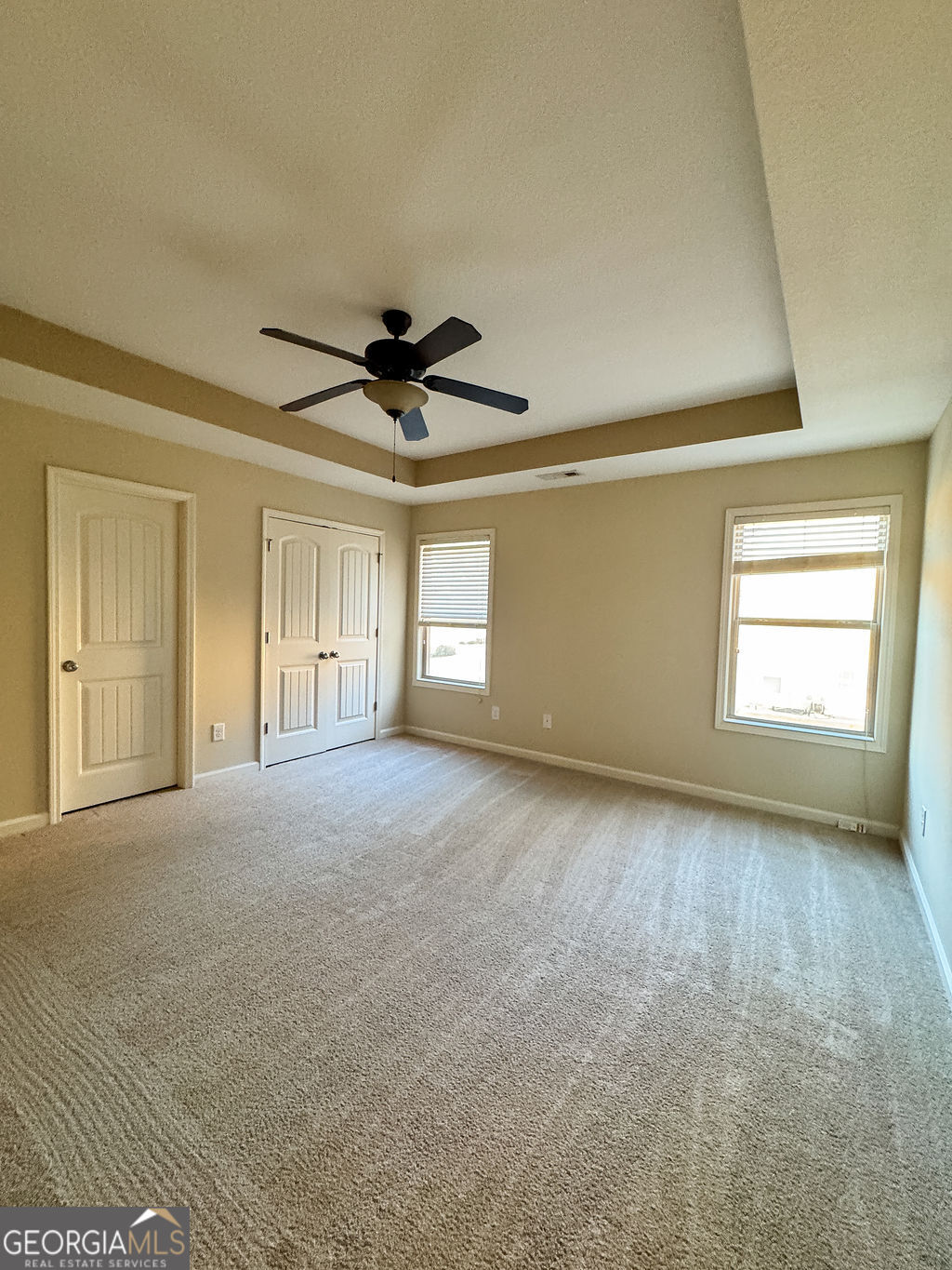 170 Fire Crk Trail Senoia, GA 30276 - Photo 52 of 62 a view of a livingroom with a ceiling fan and window