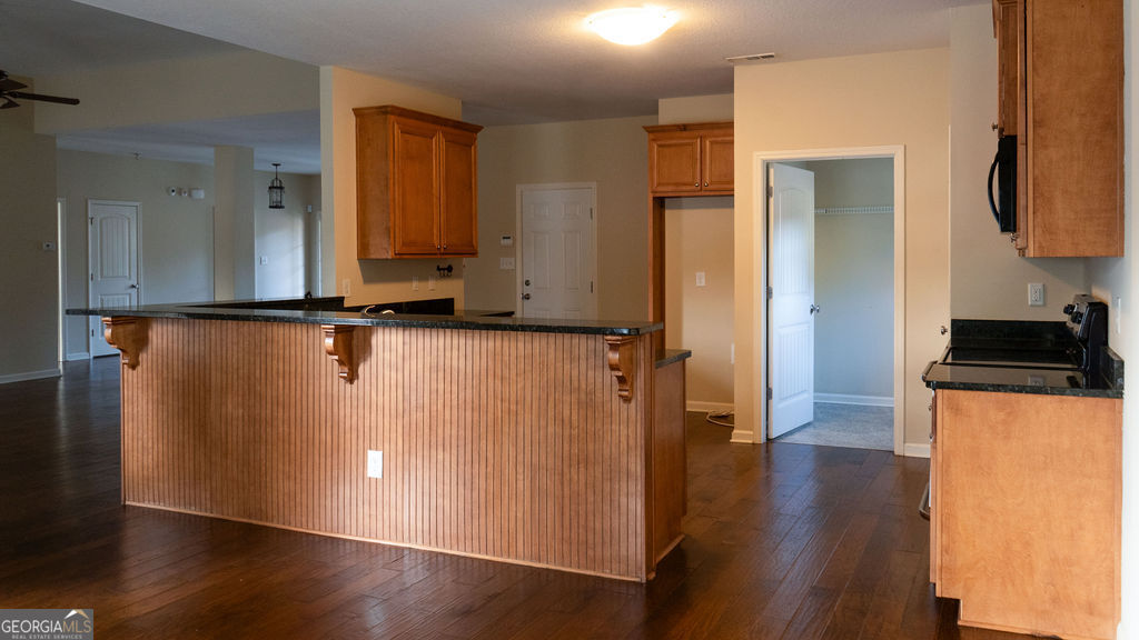 170 Fire Crk Trail Senoia, GA 30276 - Photo 10 of 62 a view of a room with wooden floor and cabinets