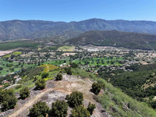 an aerial view of residential house and green space