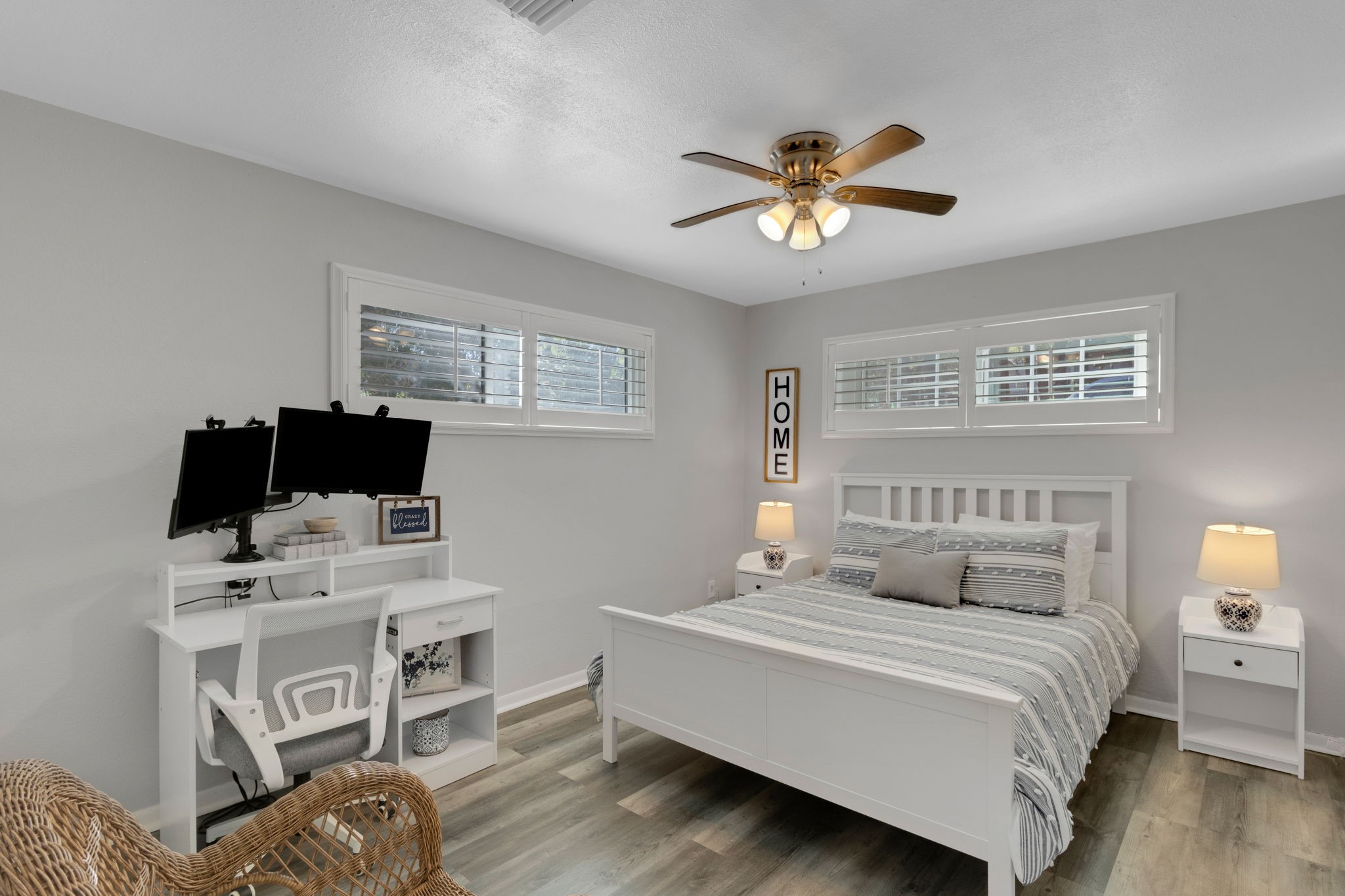 90 Harbour Lane Coldspring, TX 77331 - Photo 13 of 40 Both bedrooms feature plantation shutters and warm wood look flooring