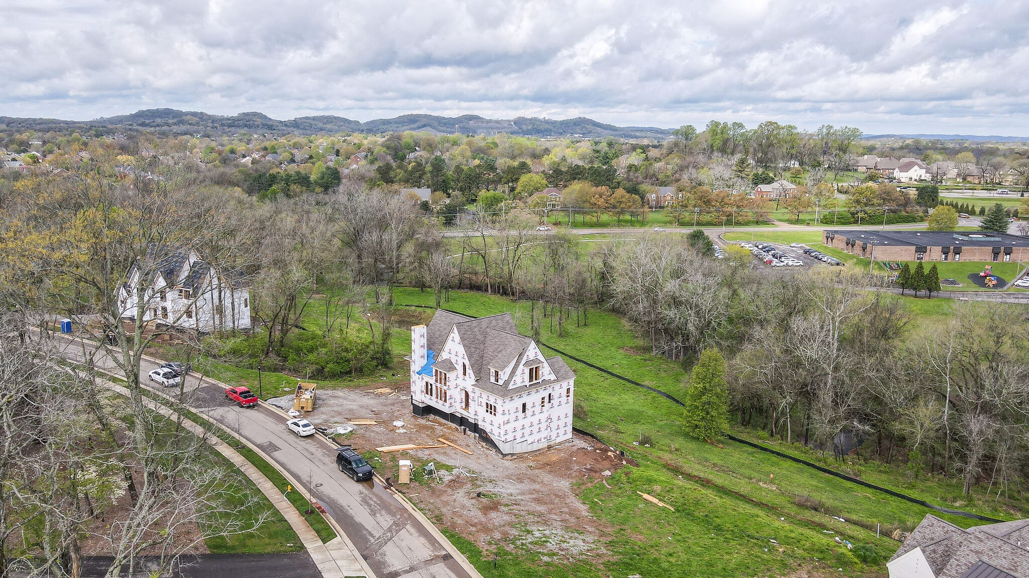 3031 Natures Landing Drive Franklin, TN 37064 - Photo 16 of 45 a view of a street with a yard and a large tree
