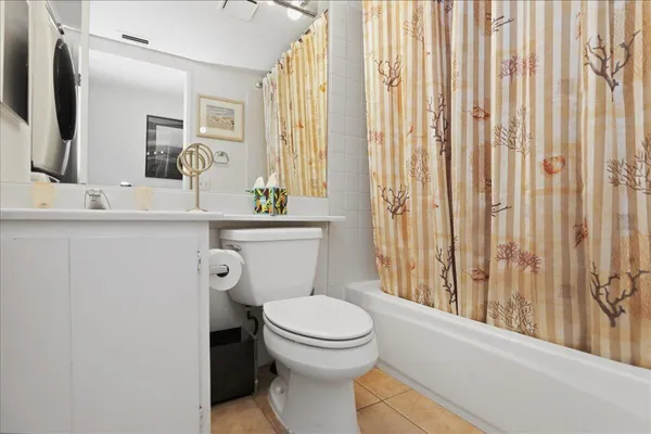 a bathroom with a toilet a sink and a mirror