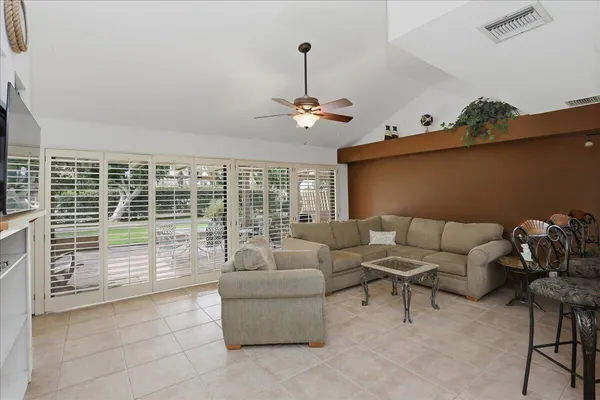 a living room with furniture and a window