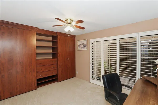 a view of workspace with furniture and window