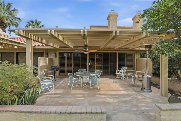 a patio with table and chairs