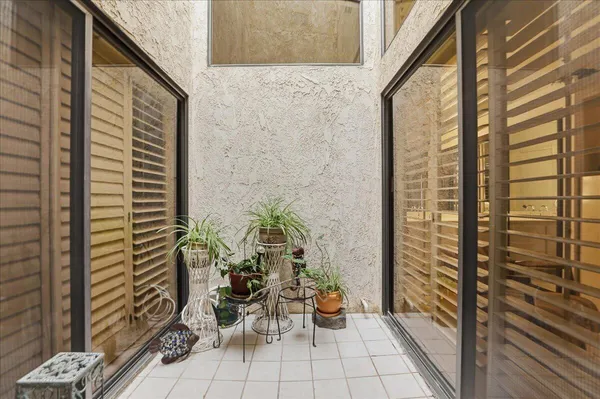 a view of balcony with chairs