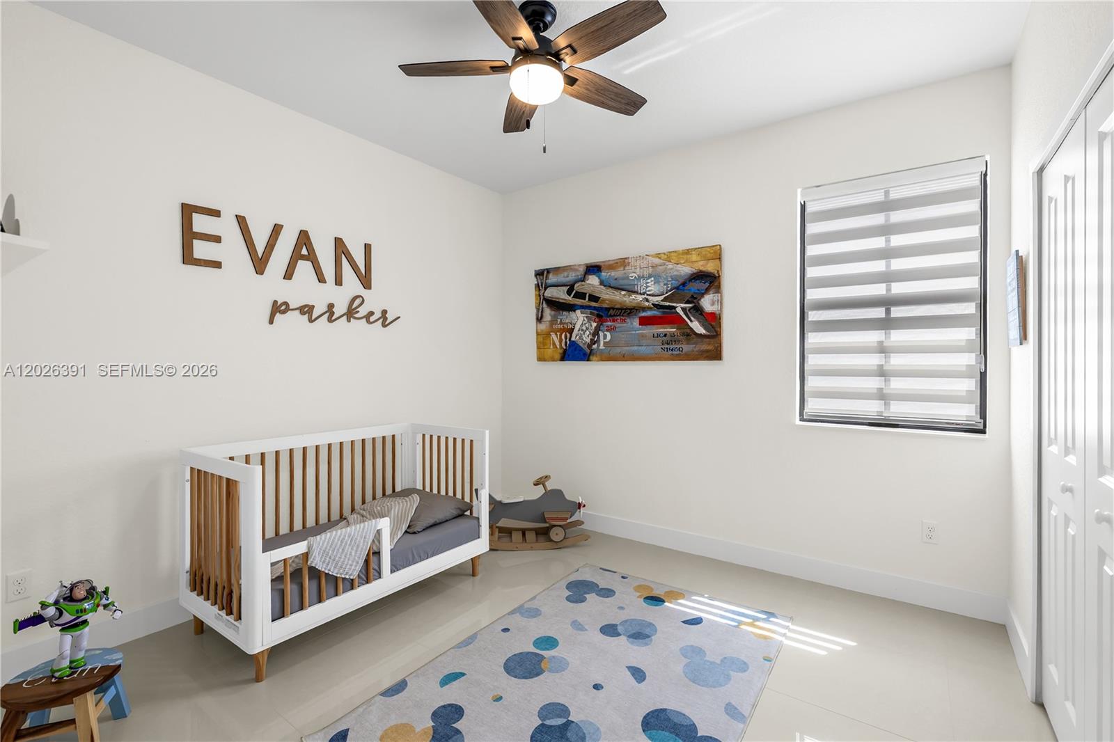 14606 Southwest 22nd Terrace Miami, FL 33175 - Photo 36 of 43 a living room with a baby crib furniture and a window