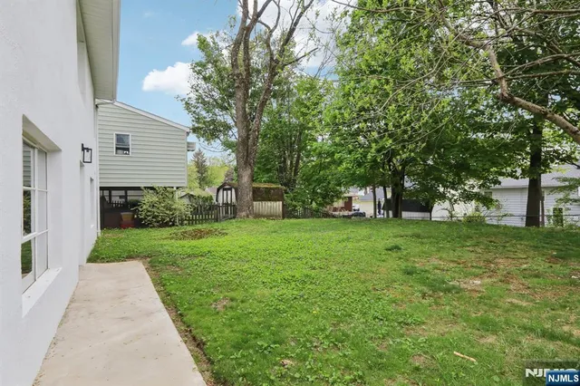 a view of a backyard with a garden