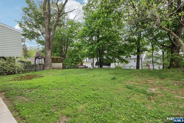 a view of outdoor space with deck and garden