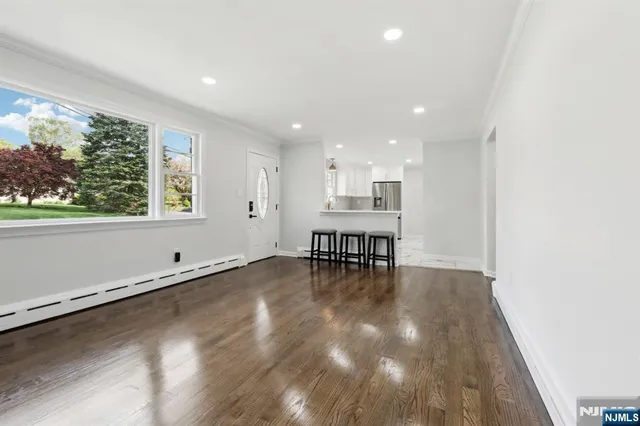 a view of a kitchen with dining table and chairs