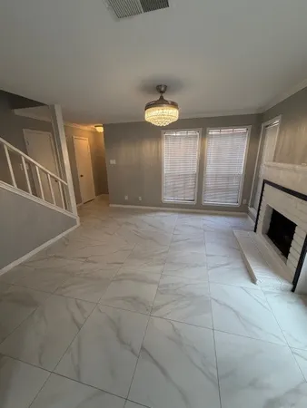 a view of a hallway with a kitchen