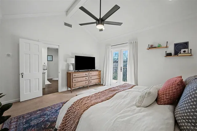 a spacious bathroom with a granite countertop sink and a mirror