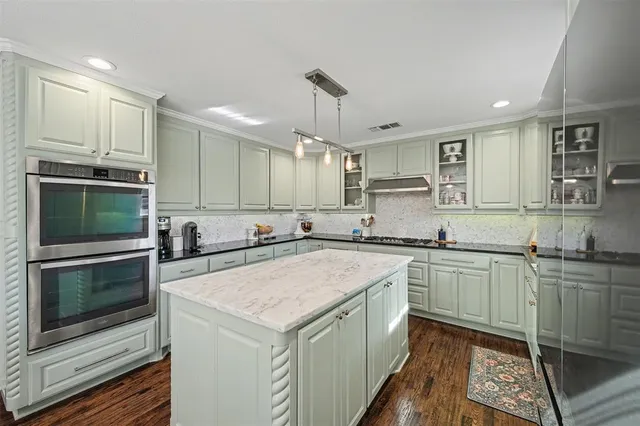 a outdoor space with a couch and wooden floor